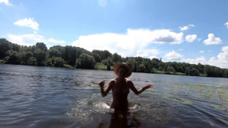 An exhibitionist Girl walks on the Moscow River Nudist Beach Serebryany Bor