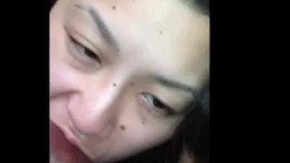 Asian chick sucking black dick with style